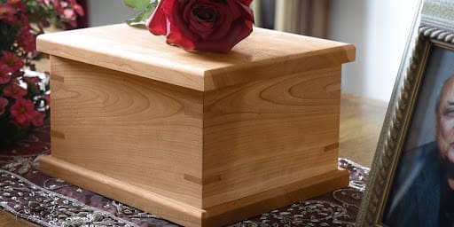 text on image reads: Wooden urn for human ashes example